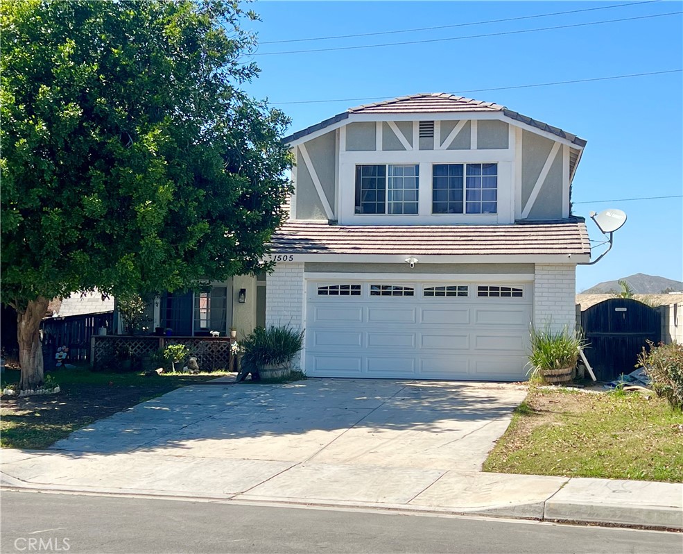 1505 Salmon River Road Riverside, CA 92501 - Photo 1 of 20 a front view of a house with a yard