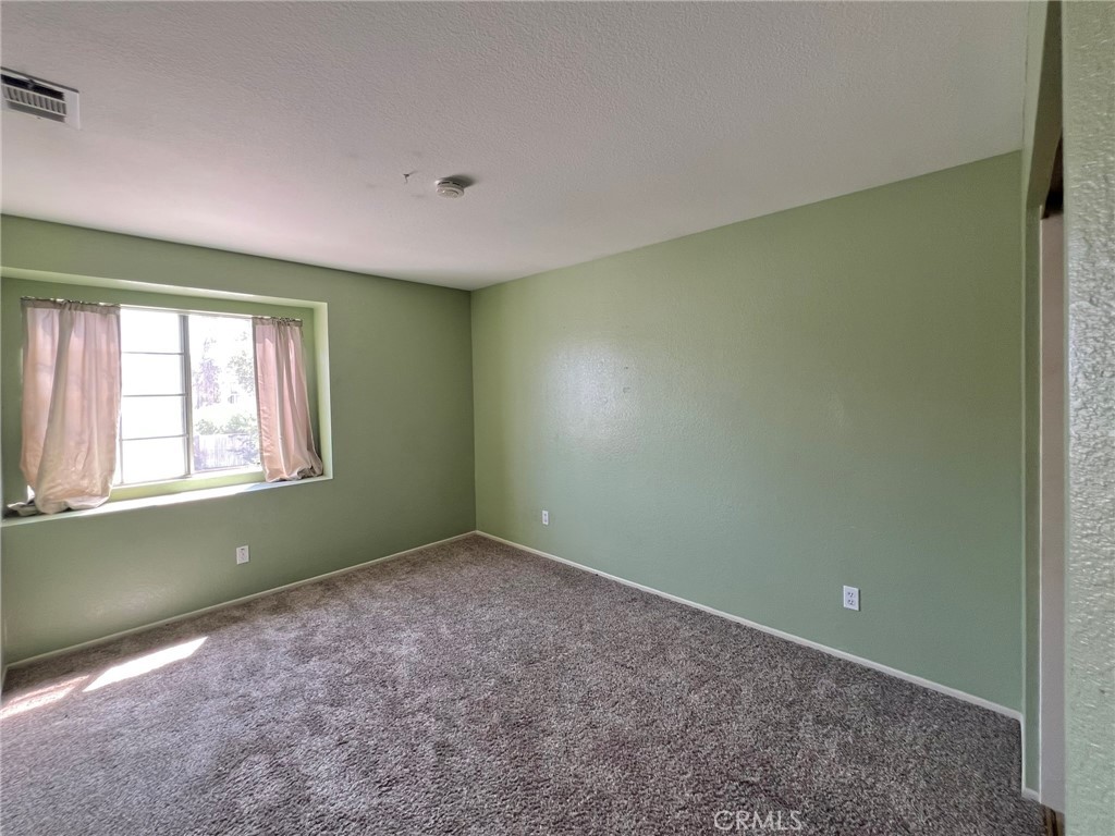 1505 Salmon River Road Riverside, CA 92501 - Photo 12 of 20 a view of an empty room with a window