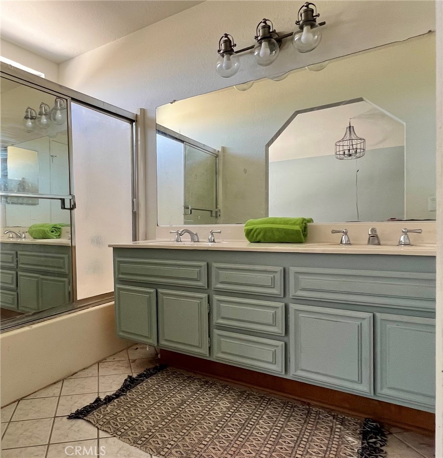 1505 Salmon River Road Riverside, CA 92501 - Photo 16 of 20 a bathroom with a sink vanity and mirror