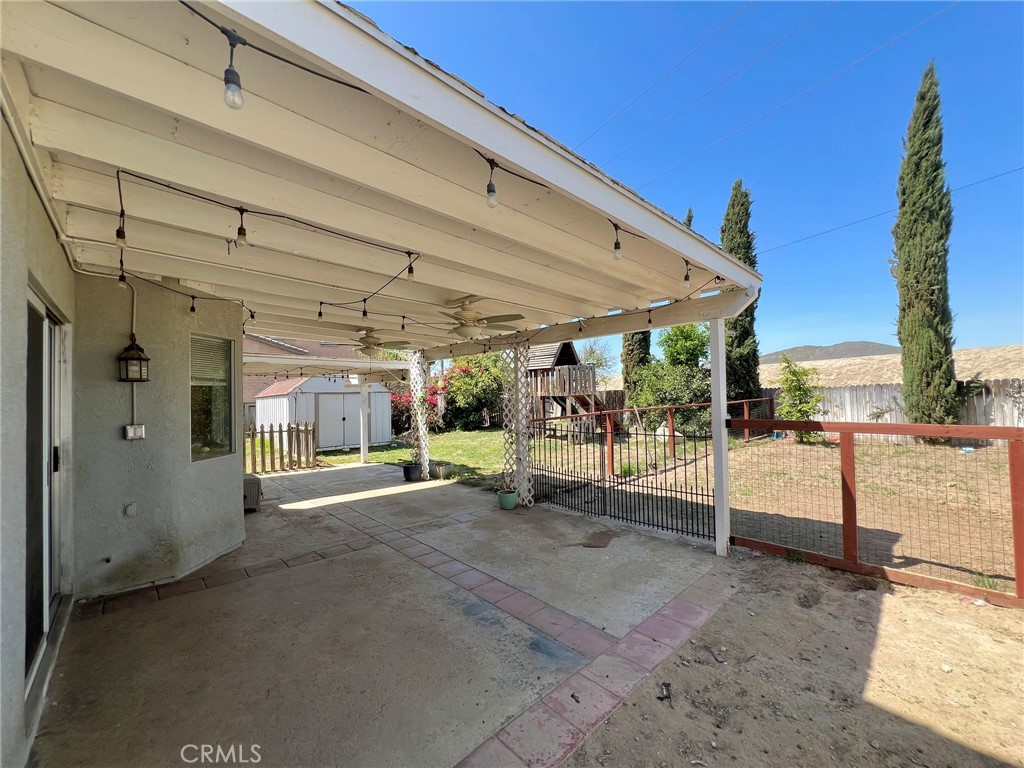 1505 Salmon River Road Riverside, CA 92501 - Photo 17 of 20 a view of a living room with furniture and a garage