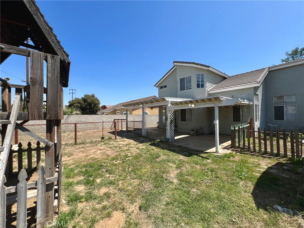 1505 Salmon River Road Riverside, CA 92501 - Photo 19 of 20 a front view of a house with a yard outdoor seating and garage
