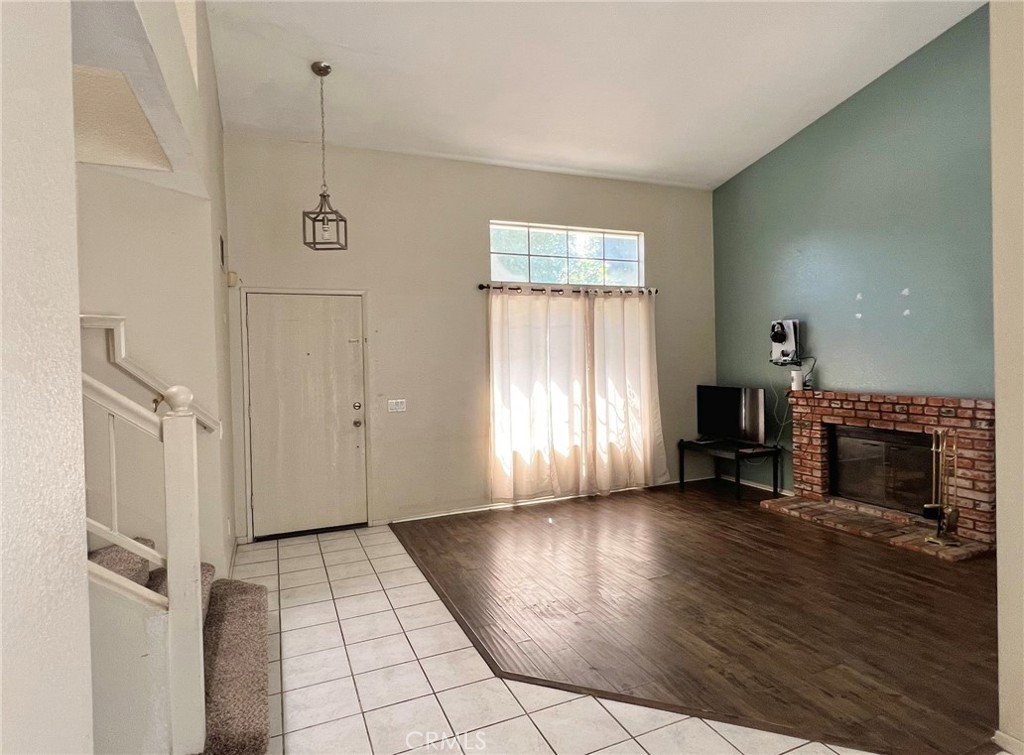 1505 Salmon River Road Riverside, CA 92501 - Photo 3 of 20 a view of a livingroom with wooden floor fireplace and window