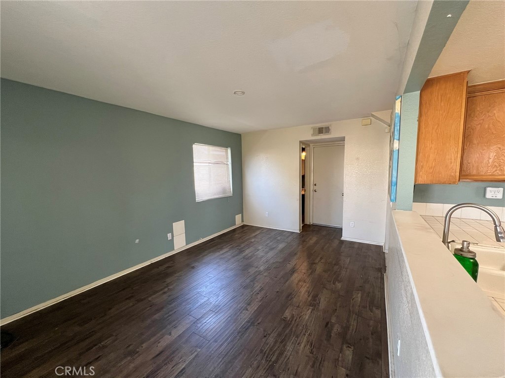 1505 Salmon River Road Riverside, CA 92501 - Photo 9 of 20 a view of a livingroom with wooden floor and a window