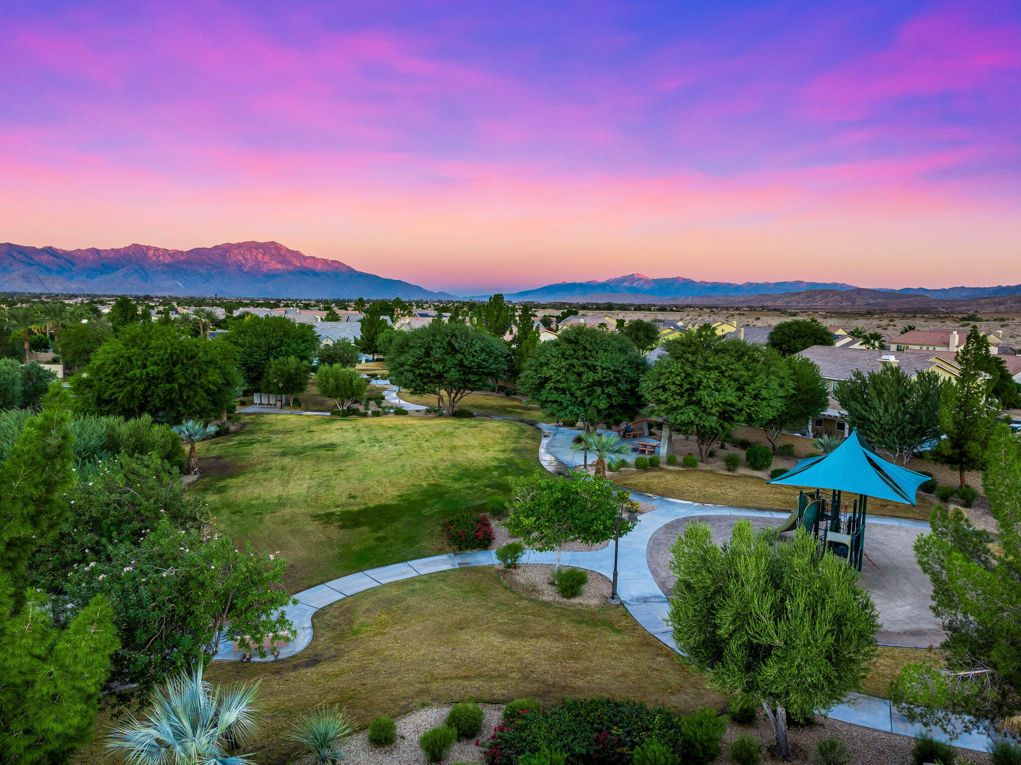 80510 Denton Drive Indio, CA 92203 - Photo 12 of 80 a view of a house with a yard and a pond