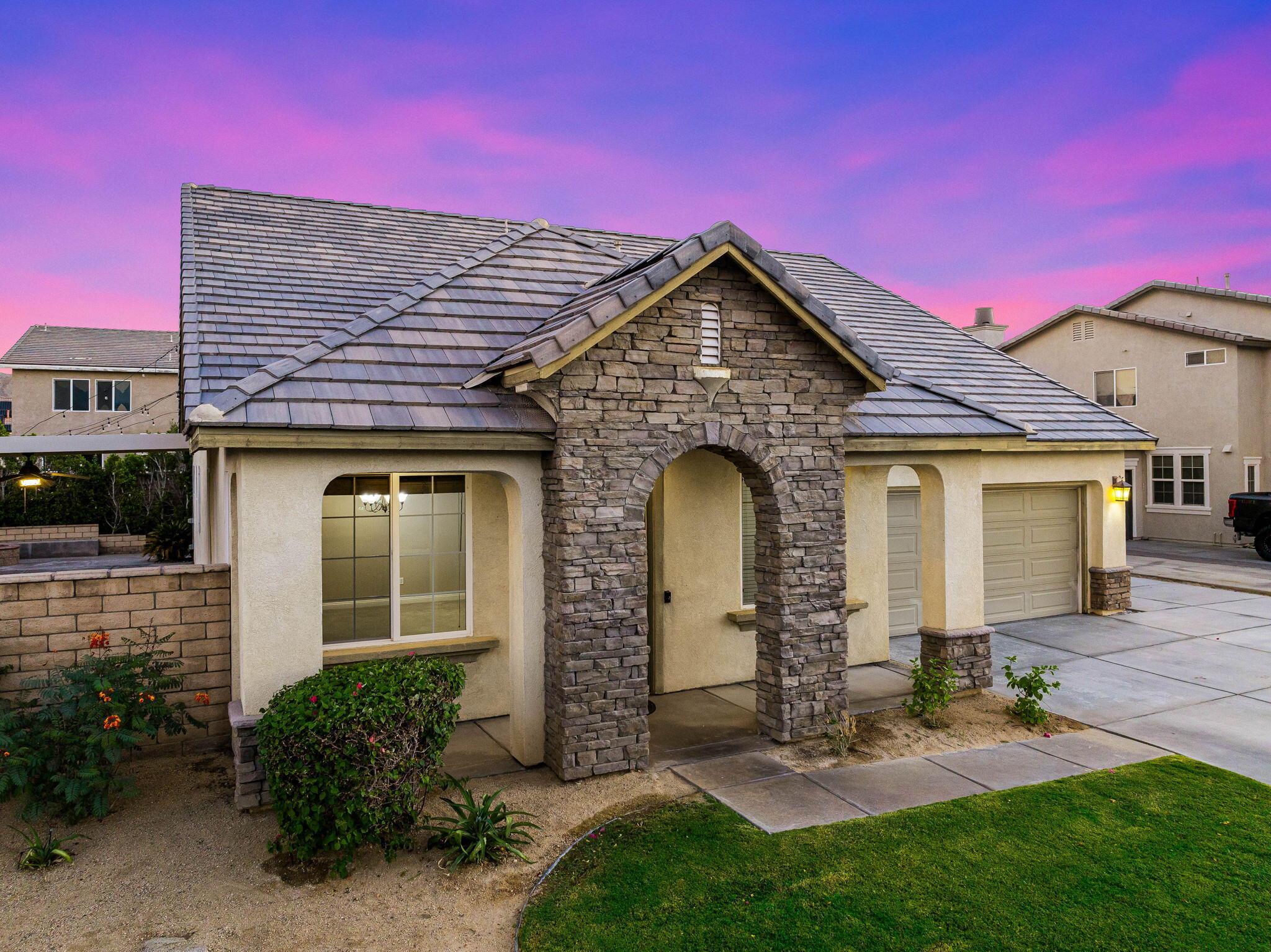 80510 Denton Drive Indio, CA 92203 - Photo 17 of 80 a front view of a house with garden
