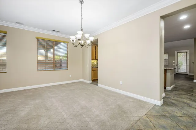 a view of a kitchen with a sink and dishwasher a oven with wooden floor