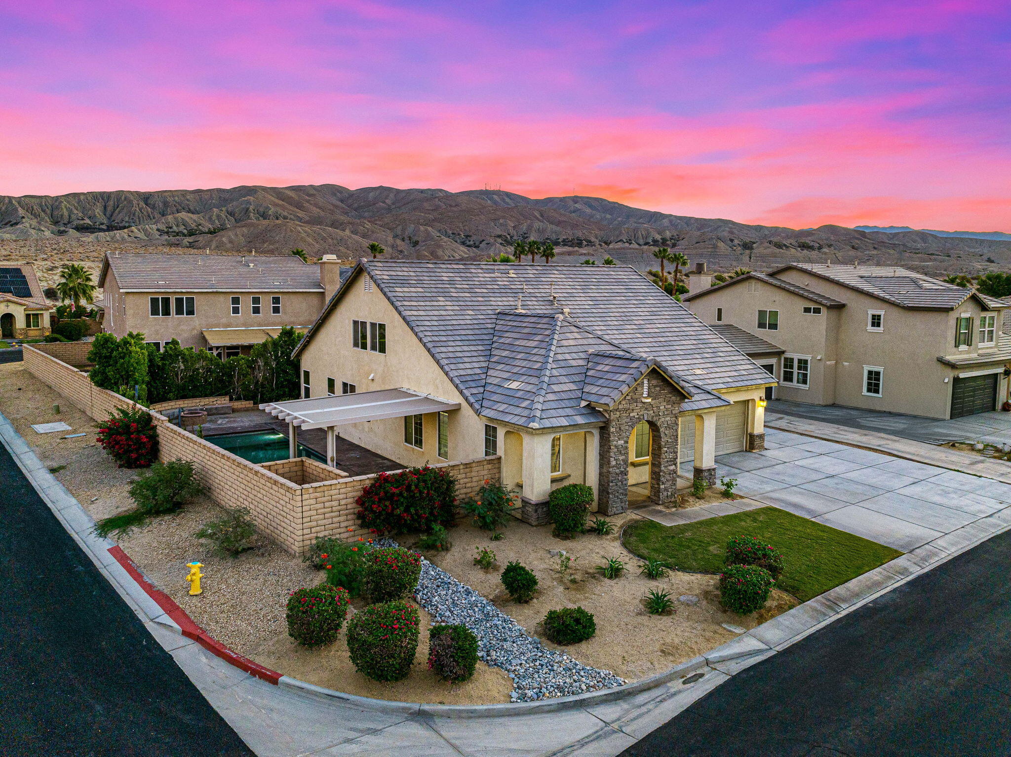 80510 Denton Drive Indio, CA 92203 - Photo 3 of 80 a view of a white house with a yard
