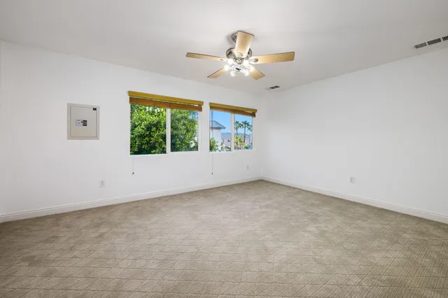 a backyard of a house with yard fire pit and outdoor seating
