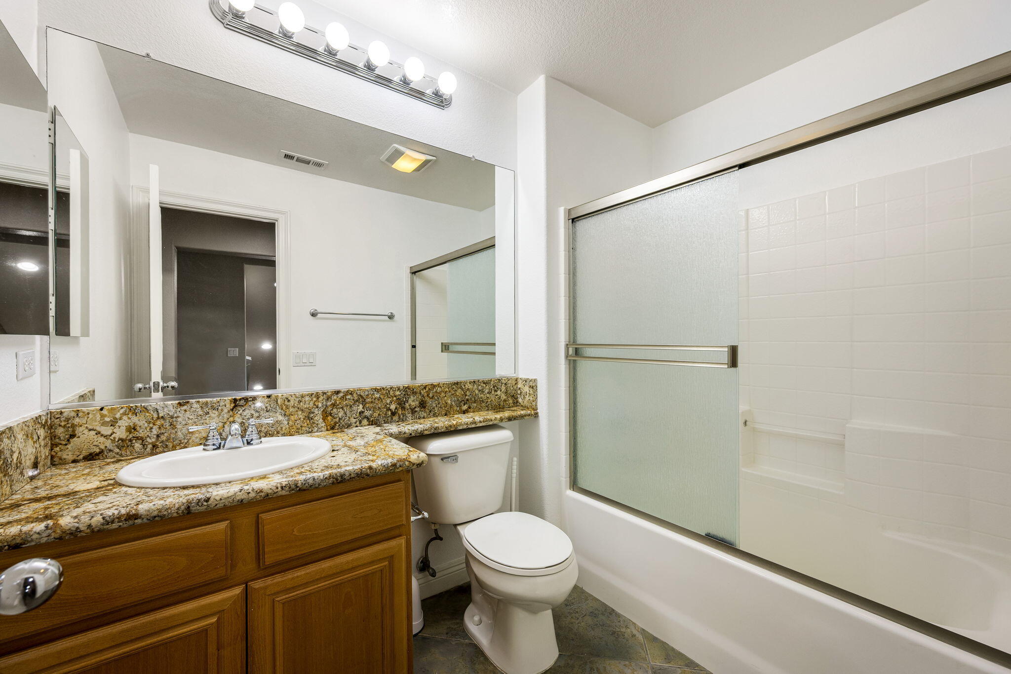 80510 Denton Drive Indio, CA 92203 - Photo 38 of 80 a bathroom with a granite countertop sink toilet and shower