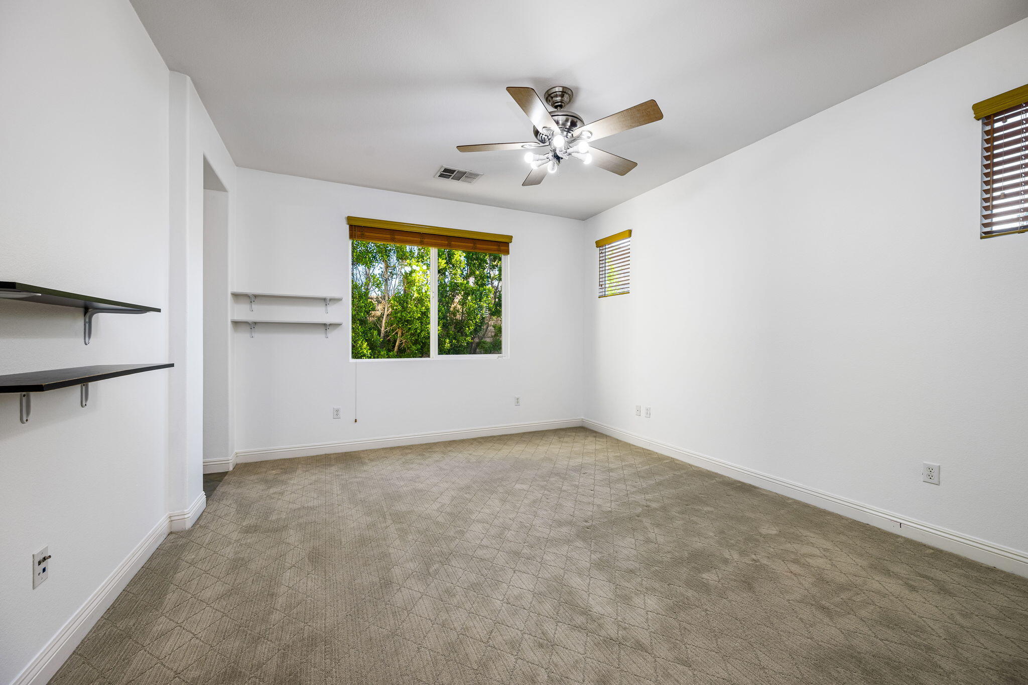 80510 Denton Drive Indio, CA 92203 - Photo 39 of 80 an empty room with windows and fan