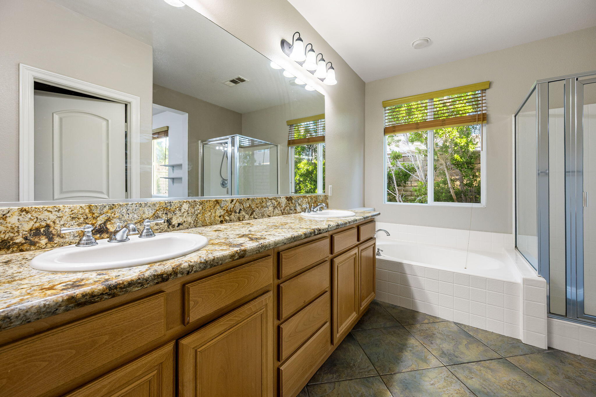 80510 Denton Drive Indio, CA 92203 - Photo 41 of 80 a bathroom with a bathtub sink and mirror