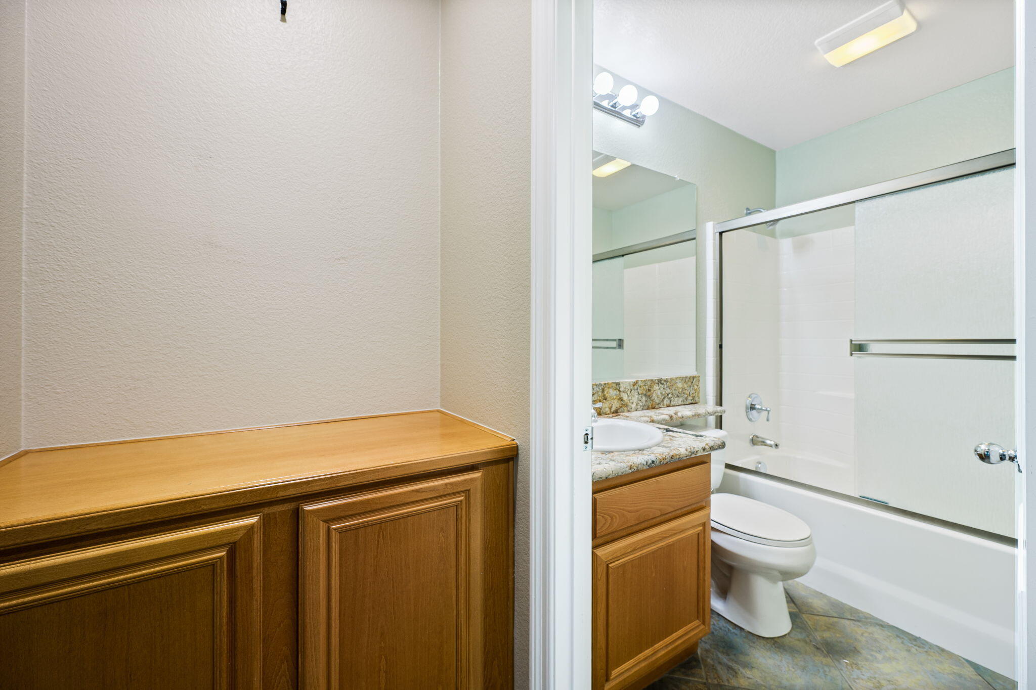 80510 Denton Drive Indio, CA 92203 - Photo 44 of 80 a bathroom with a granite countertop sink toilet a mirror and shower