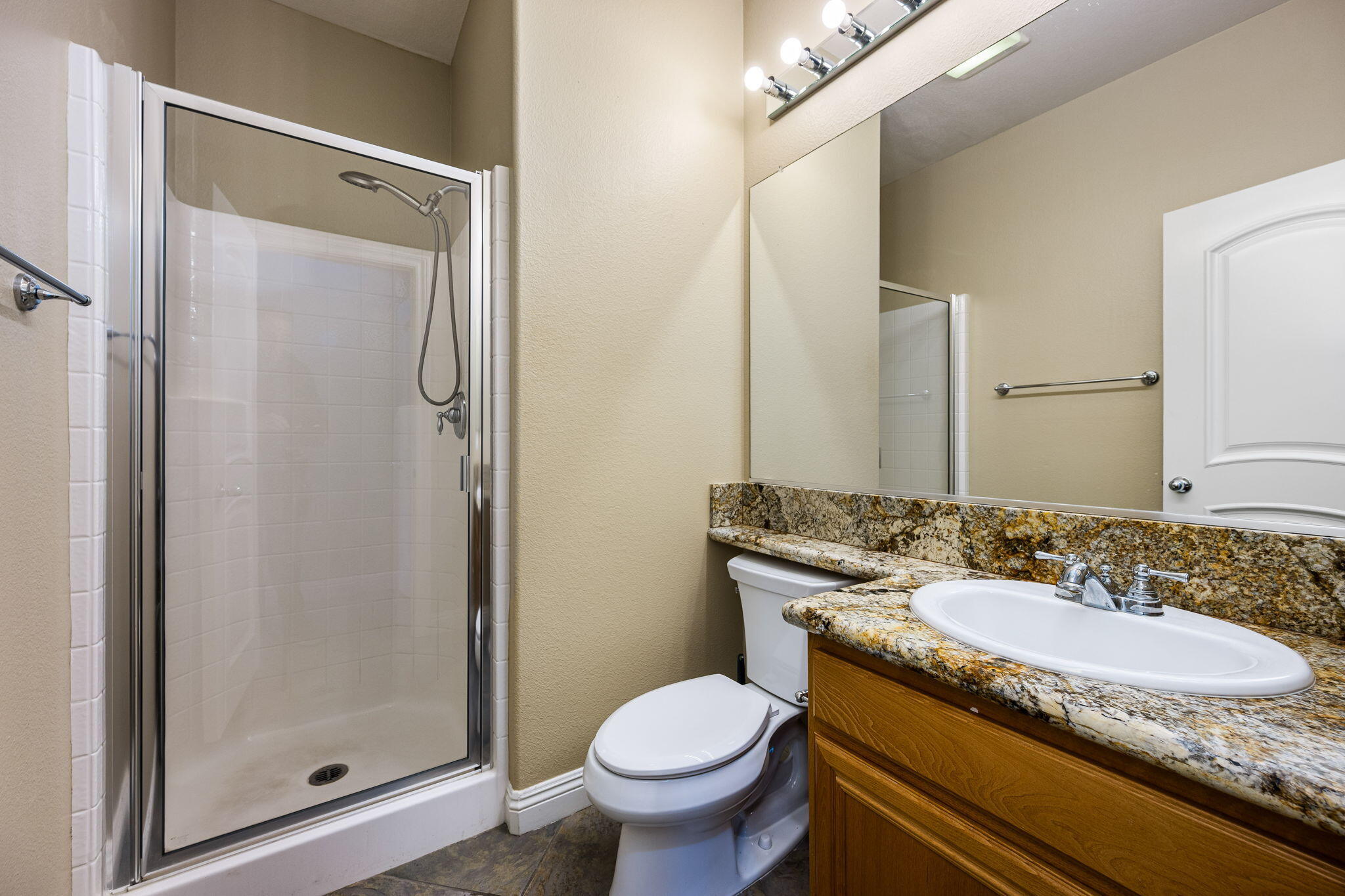 80510 Denton Drive Indio, CA 92203 - Photo 47 of 80 a bathroom with a granite countertop sink toilet and shower