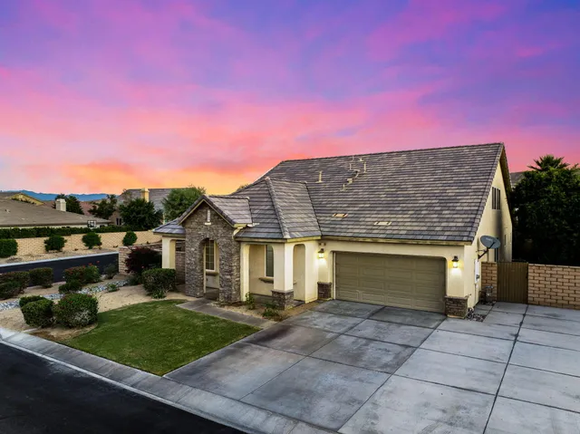 a view of houses with outdoor space and mountain view