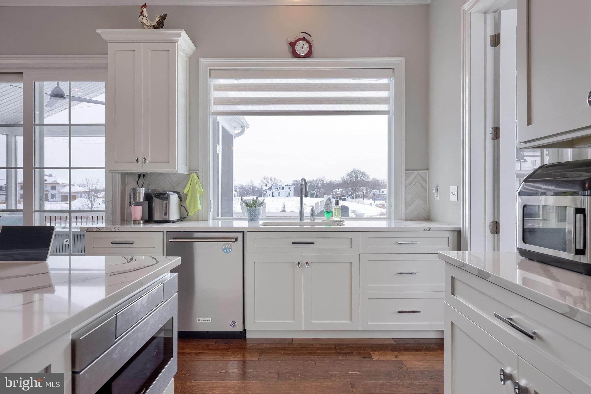 512 East Delp Road Lancaster, PA 17601 - Photo 13 of 75 a kitchen with granite countertop white cabinets and a window