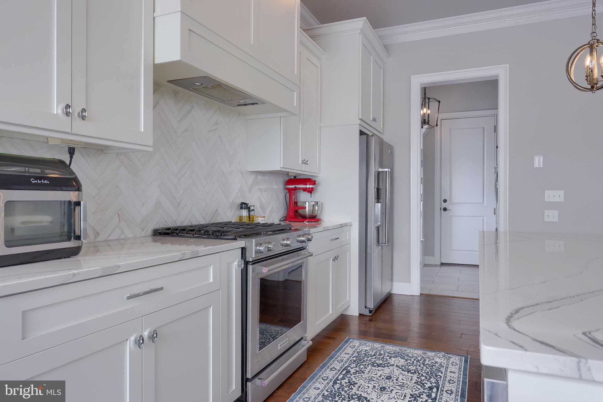 512 East Delp Road Lancaster, PA 17601 - Photo 14 of 75 a kitchen with stainless steel appliances granite countertop a stove and a refrigerator