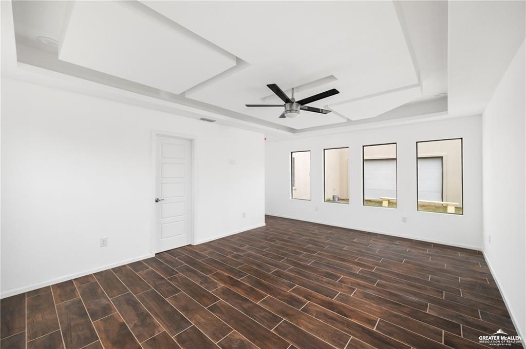 2105 Azalea Street Mission, TX 78573 - Photo 7 of 14 a view of empty room with wooden floor and fan