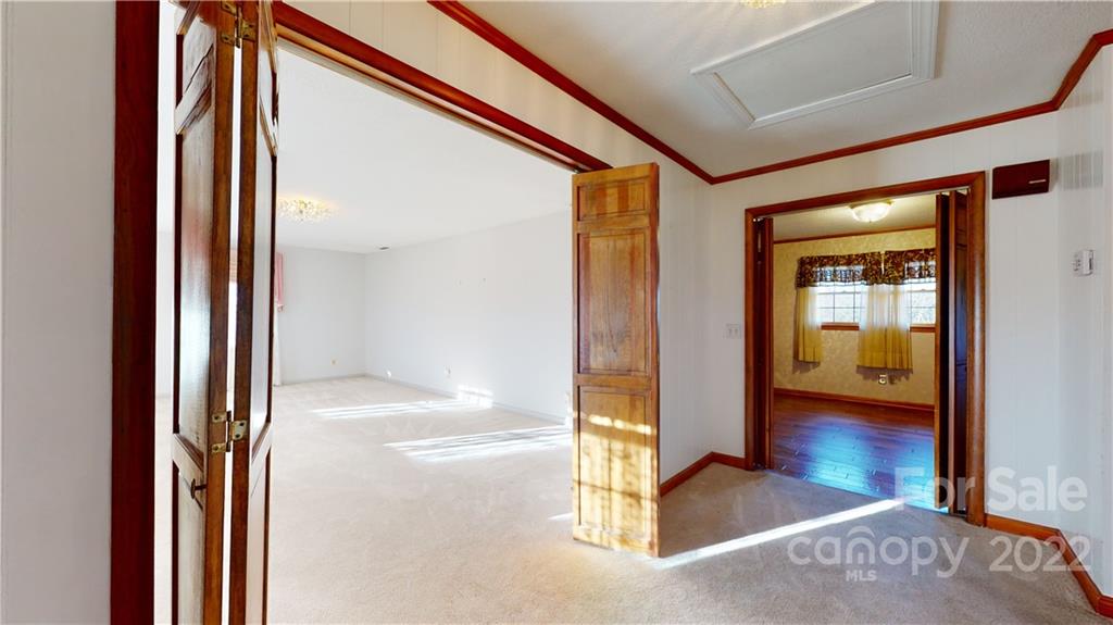 219 Ridge Road Marion, NC 28752 - Photo 11 of 28 a view of a hallway view with wooden floor and living room