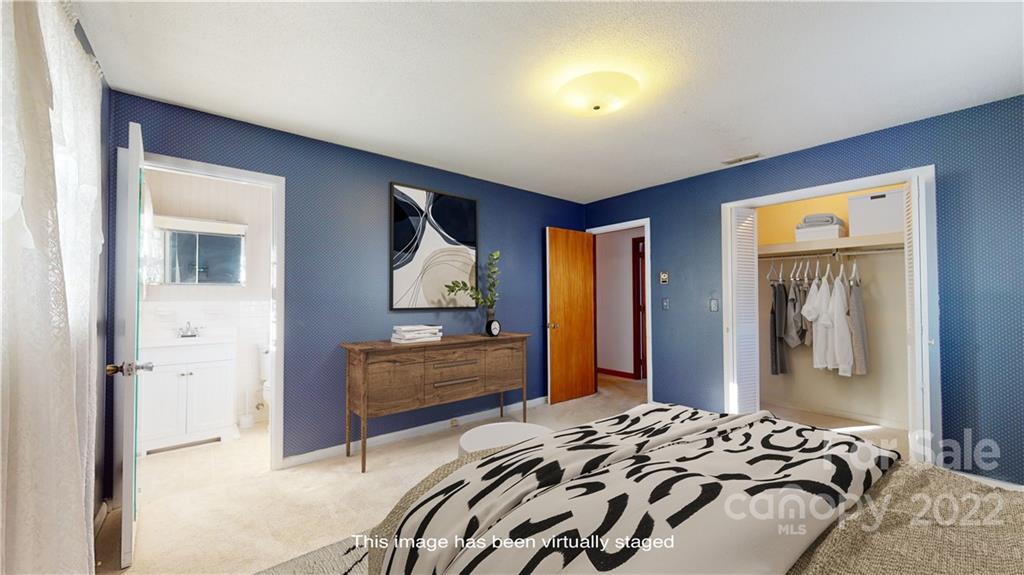 219 Ridge Road Marion, NC 28752 - Photo 18 of 28 a bedroom with a bed and a dresser