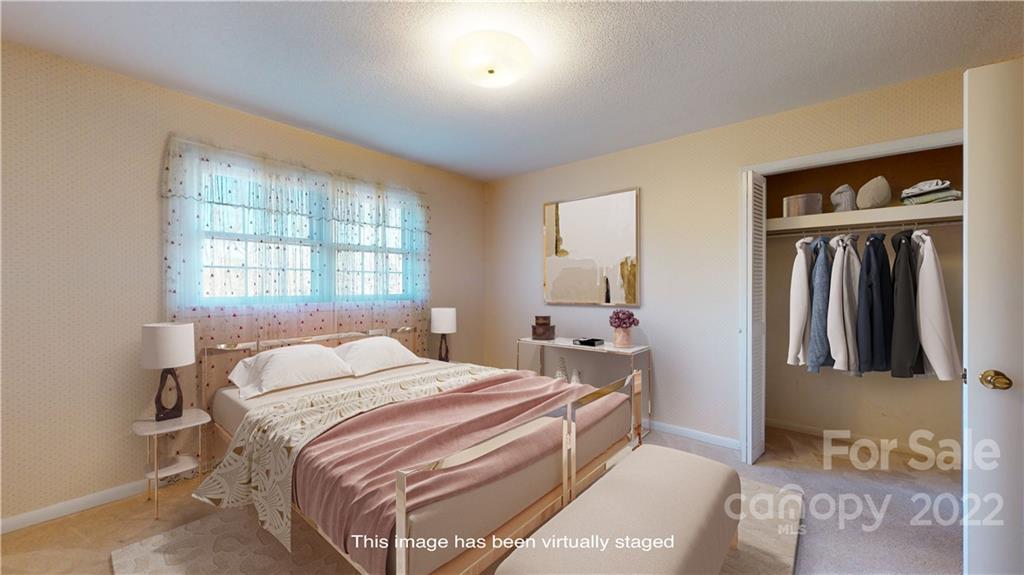 219 Ridge Road Marion, NC 28752 - Photo 20 of 28 a bedroom with a bed and a window