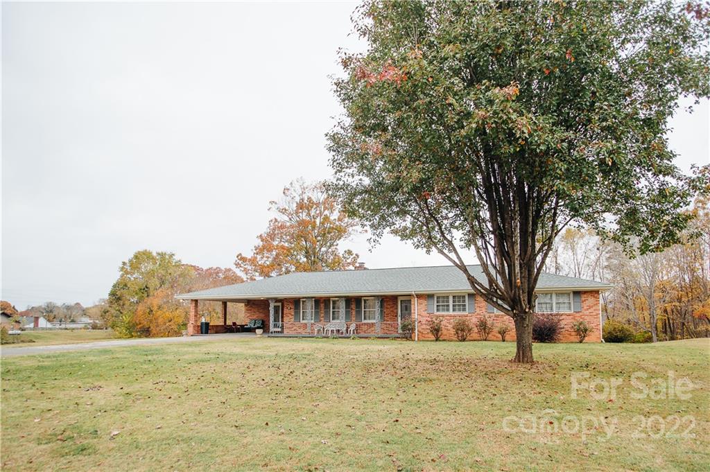 219 Ridge Road Marion, NC 28752 - Photo 2 of 28 a front view of a house with a garden
