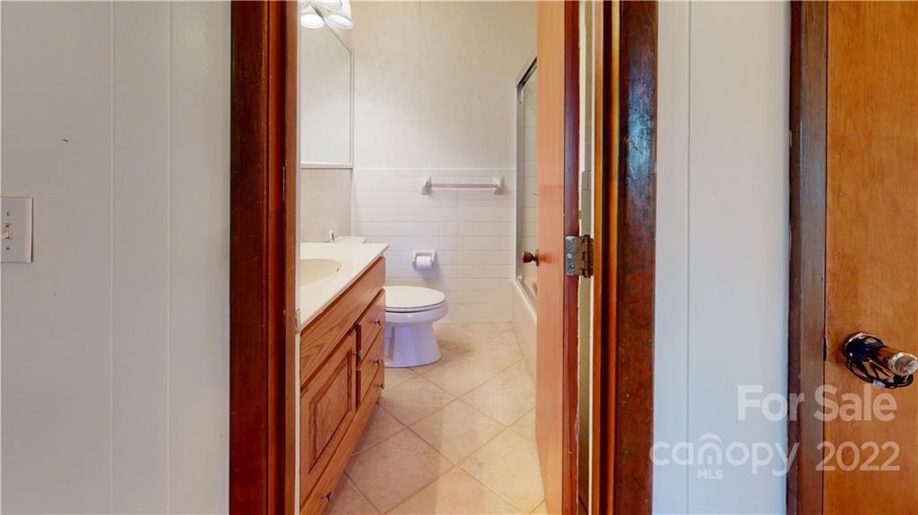 219 Ridge Road Marion, NC 28752 - Photo 23 of 28 a bathroom with a toilet and a shower