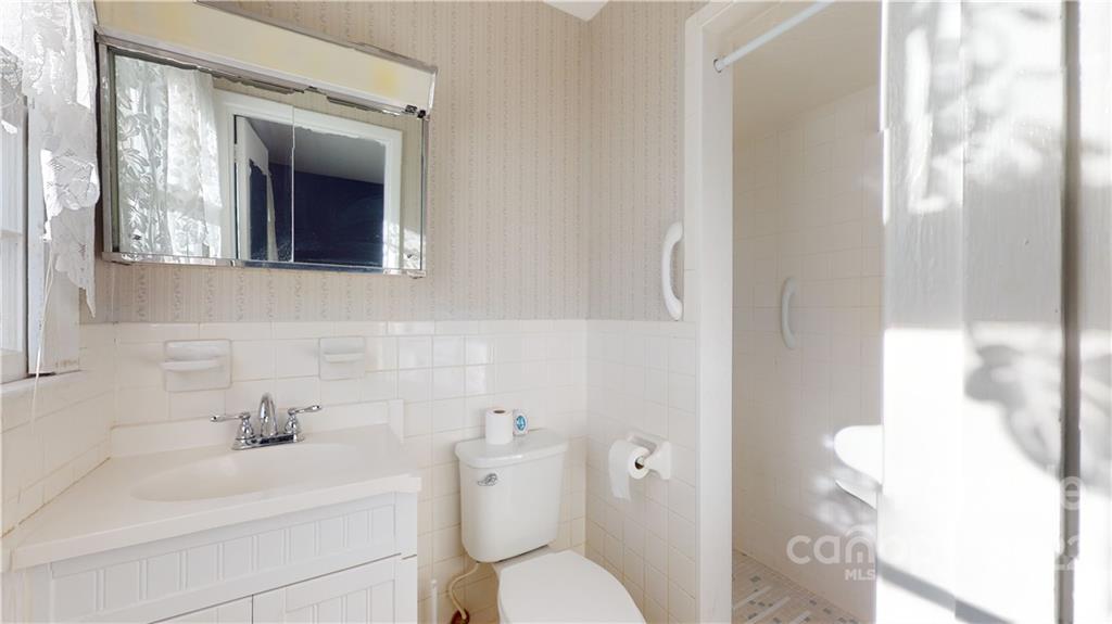 219 Ridge Road Marion, NC 28752 - Photo 26 of 28 a bathroom with a sink and a toilet