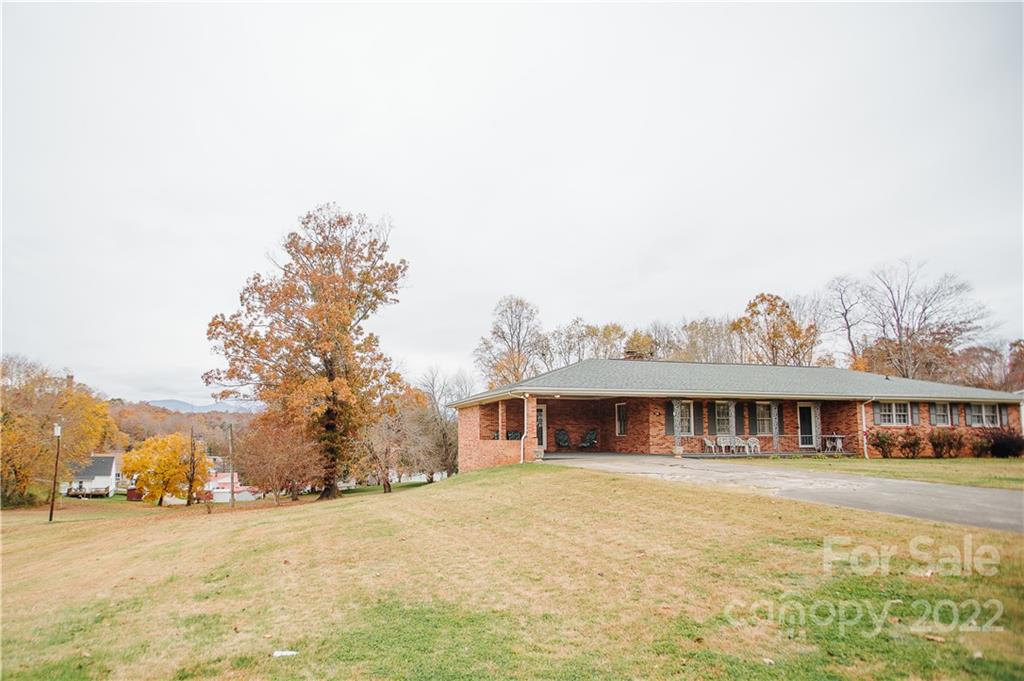 219 Ridge Road Marion, NC 28752 - Photo 3 of 28 a front view of house with yard and trees around