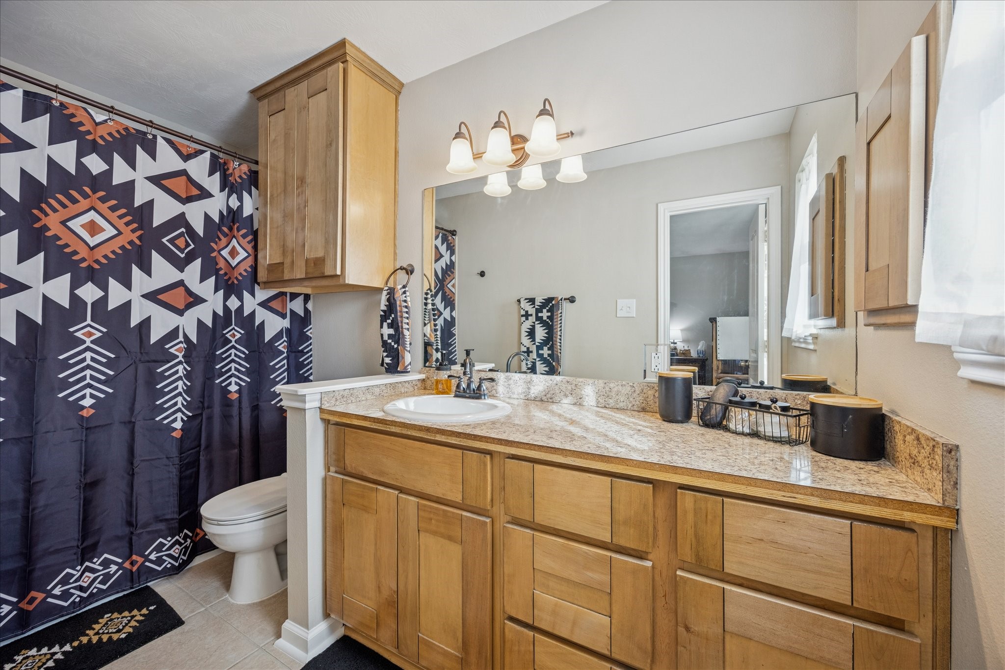 19115 Frey Road Hempstead, TX 77445 - Photo 16 of 35 a bathroom with a sink a toilet and a mirror