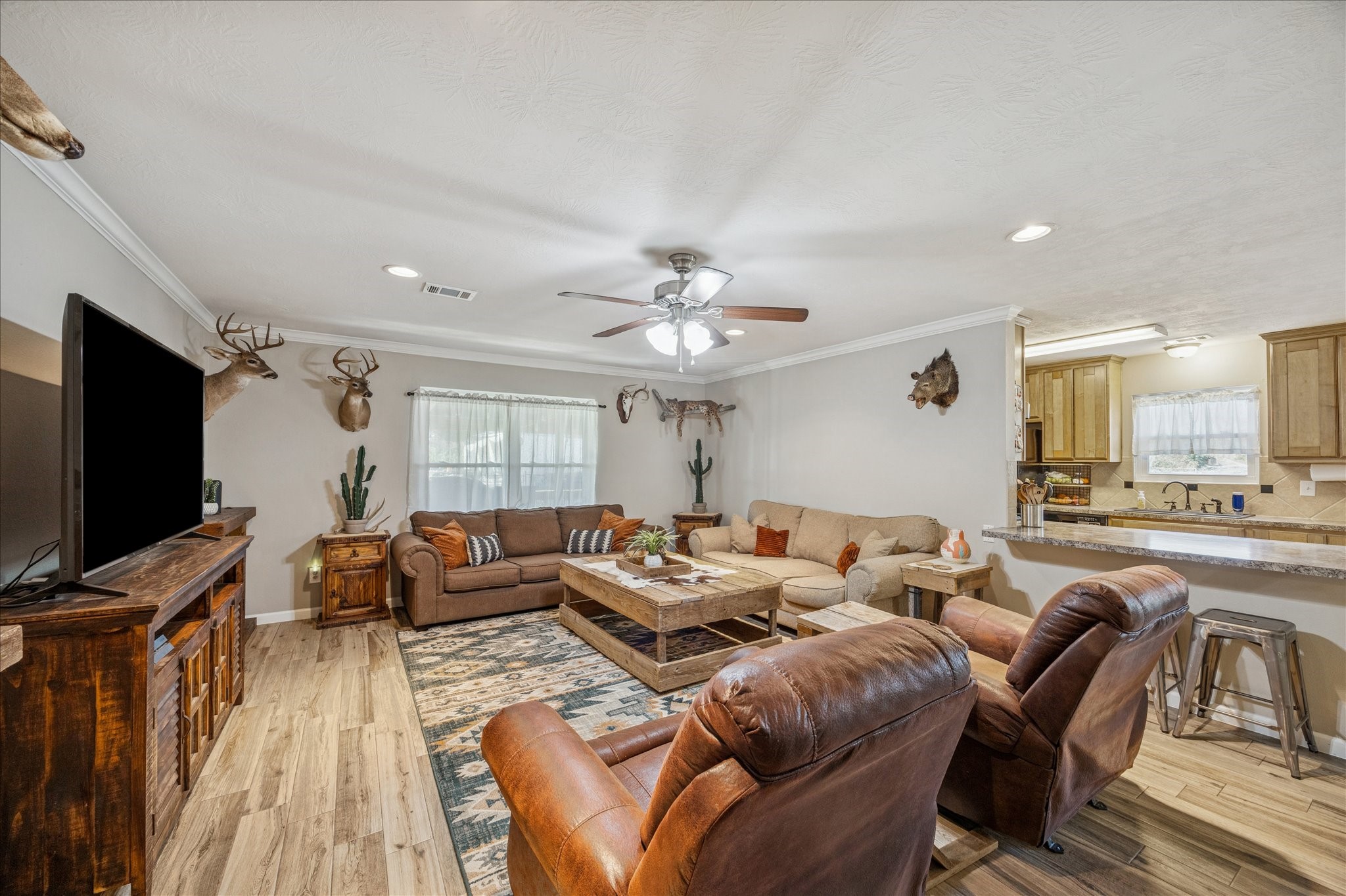 19115 Frey Road Hempstead, TX 77445 - Photo 8 of 35 a living room with furniture and a flat screen tv