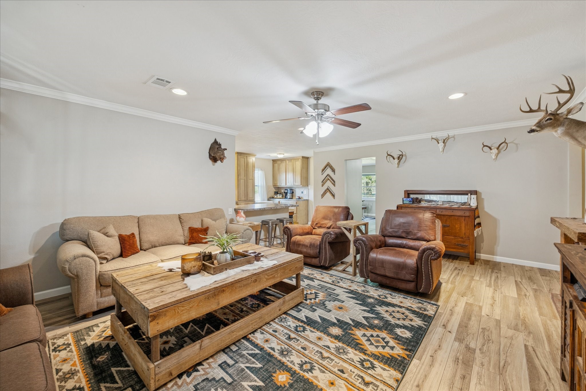 19115 Frey Road Hempstead, TX 77445 - Photo 9 of 35 a living room with furniture fireplace and wooden floor