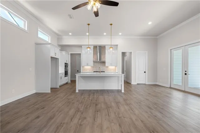 a view of kitchen with refrigerator microwave and wooden floor