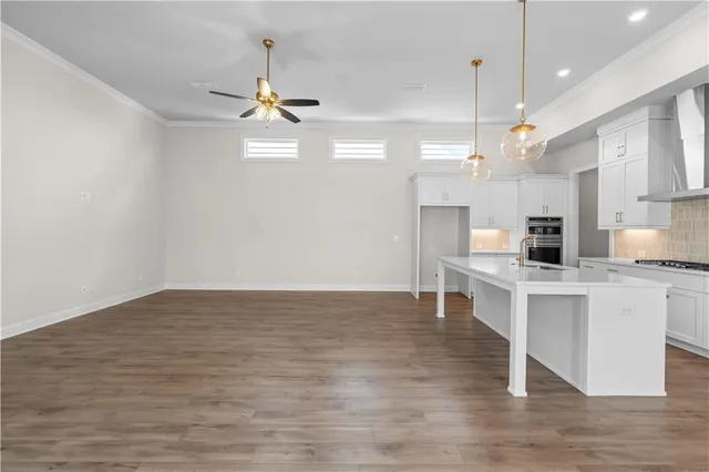 a view of kitchen with granite countertop cabinets a sink and dishwasher