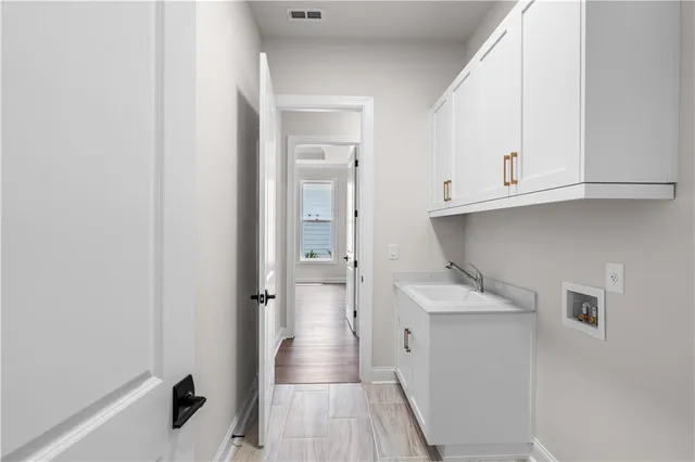 a bathroom with a sink and mirror