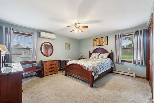 a spacious bedroom with a bed and window
