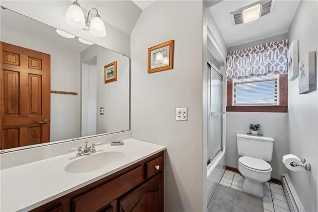 a bathroom with a sink a toilet and mirror