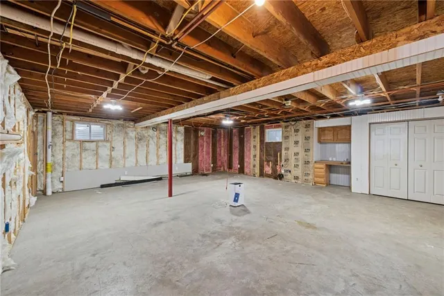a view of an empty room with a garage