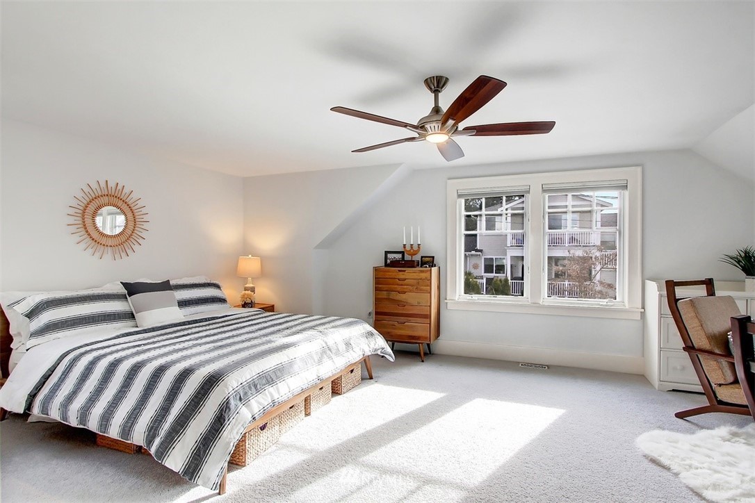 428 3rd Avenue North Edmonds, WA 98020 - Photo 11 of 21 a bedroom with a bed a chair and a large window