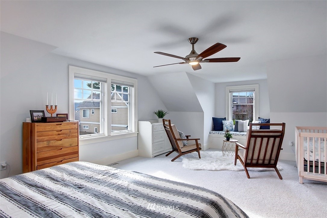 428 3rd Avenue North Edmonds, WA 98020 - Photo 12 of 21 a bedroom with a bed a desk and chair with a large mirror