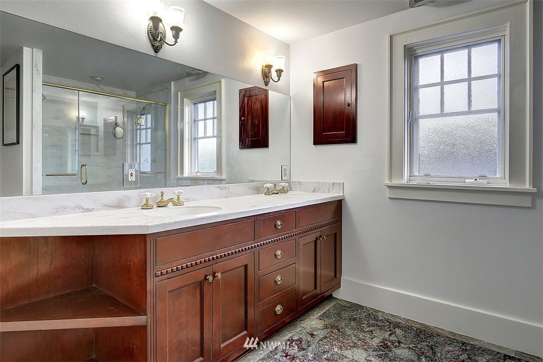 428 3rd Avenue North Edmonds, WA 98020 - Photo 13 of 21 a bathroom with a double vanity sink and mirror with window
