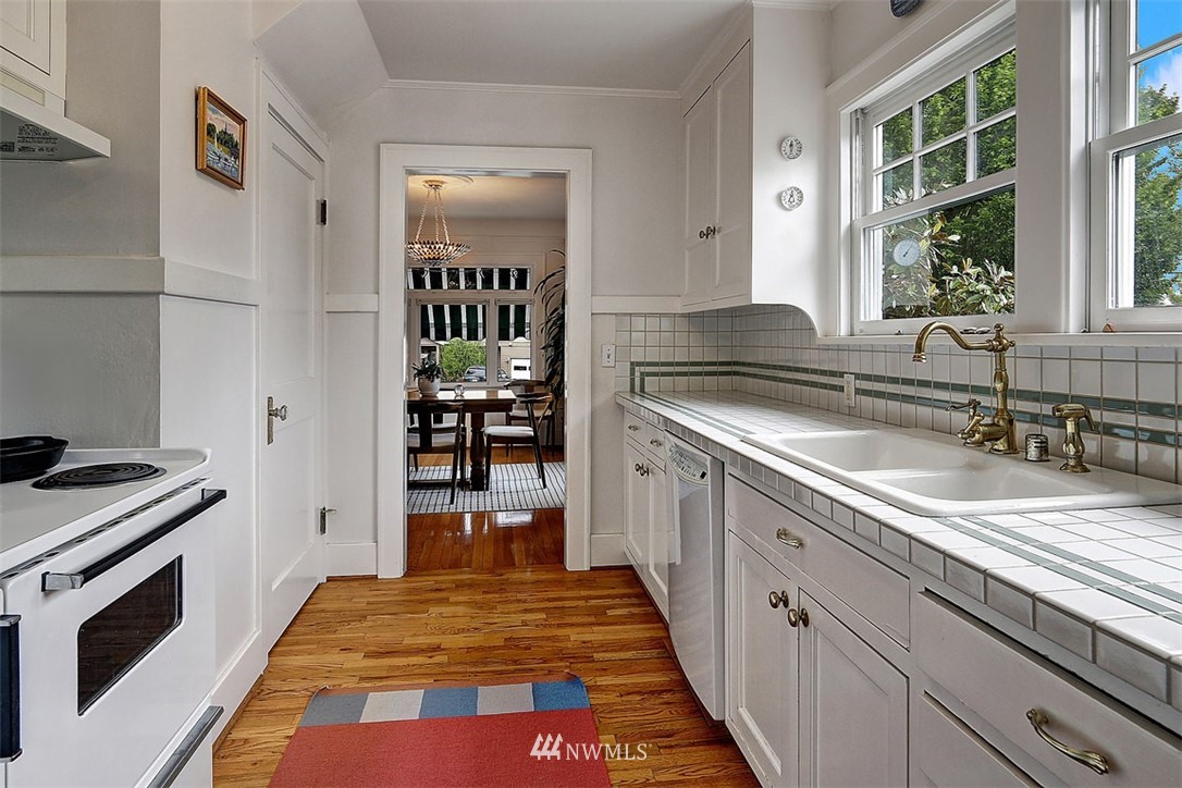 428 3rd Avenue North Edmonds, WA 98020 - Photo 6 of 21 a kitchen with granite countertop a sink and a stove