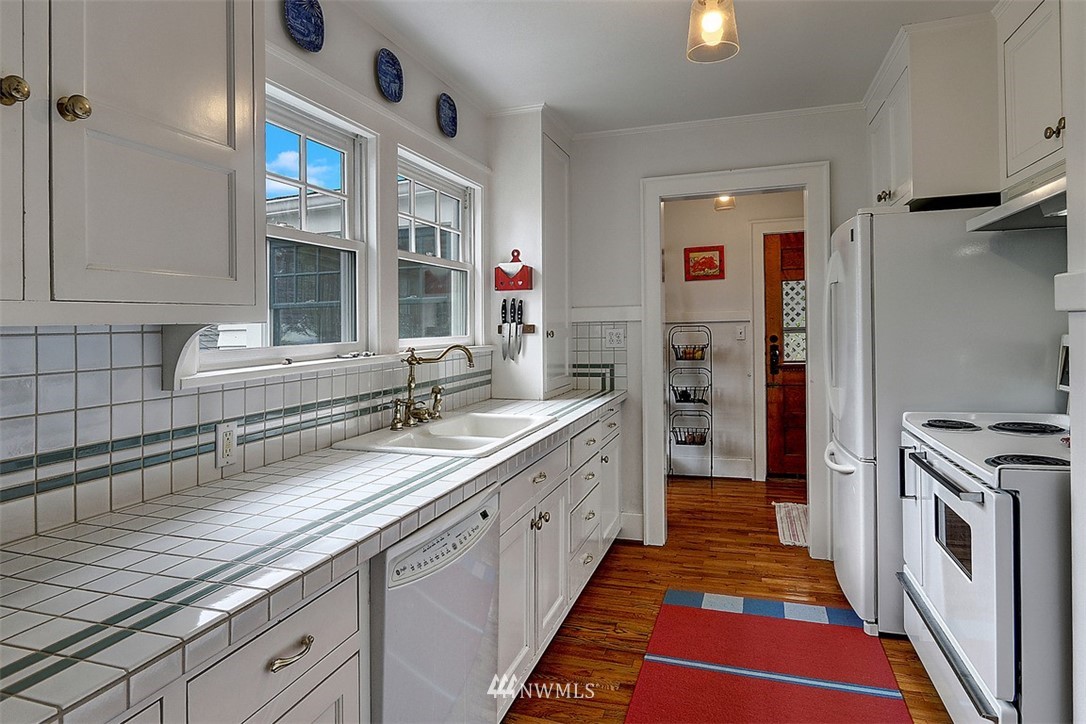428 3rd Avenue North Edmonds, WA 98020 - Photo 7 of 21 a kitchen with stainless steel appliances granite countertop a sink and a stove
