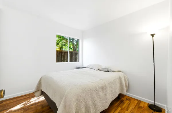 a bedroom with a bed and a closet