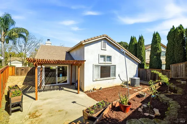a front view of house with yard outdoor seating and barbeque oven