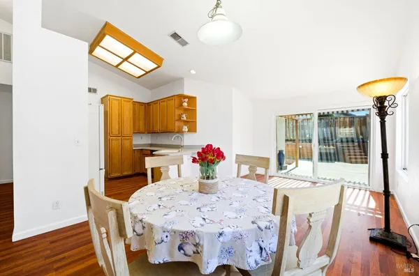 a view of a dining room with furniture and a wooden floor