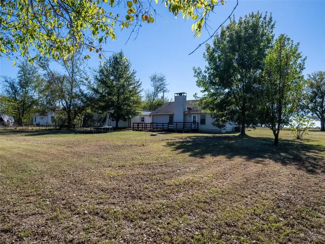 a view of backyard with green space