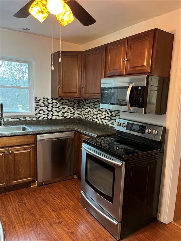 300 Highland Road Pittsburgh, PA 15235 - Photo 11 of 40 a kitchen with granite countertop wooden cabinets and stainless steel appliances