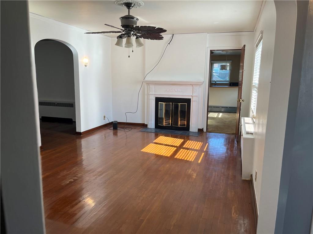 300 Highland Road Pittsburgh, PA 15235 - Photo 2 of 40 a living room with a fireplace and a table