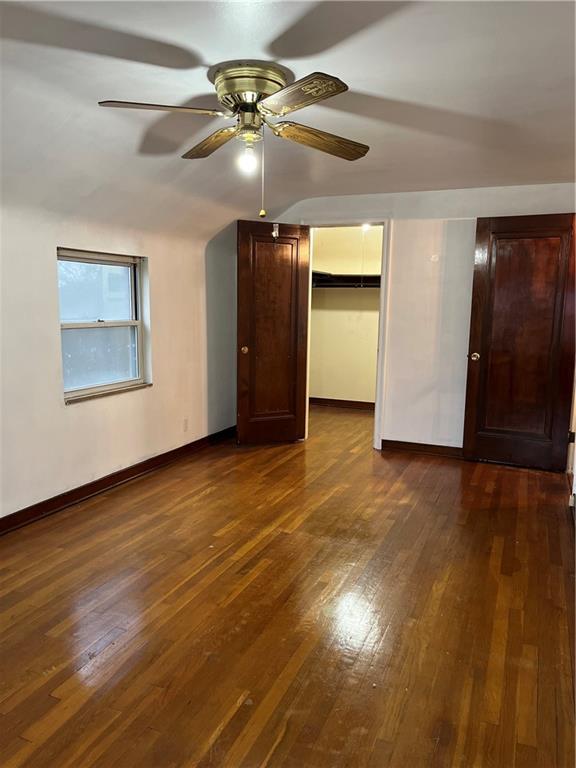 300 Highland Road Pittsburgh, PA 15235 - Photo 23 of 40 an empty room with wooden floor chandelier fan and windows