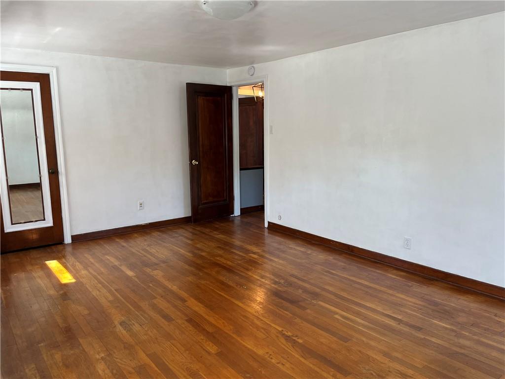 300 Highland Road Pittsburgh, PA 15235 - Photo 29 of 40 a view of an empty room with wooden floor and a window